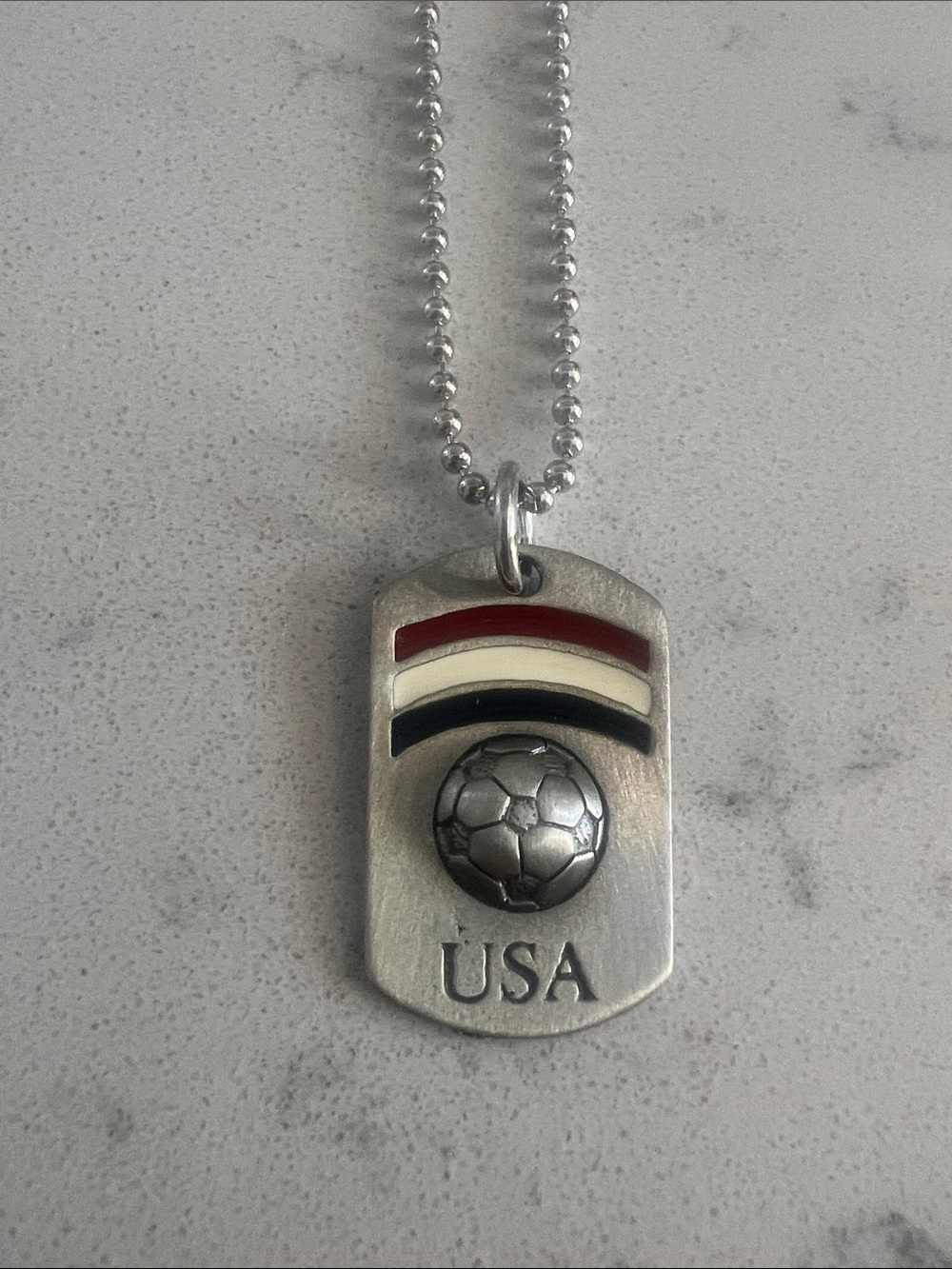 Team USA soccer dog tag on chain.